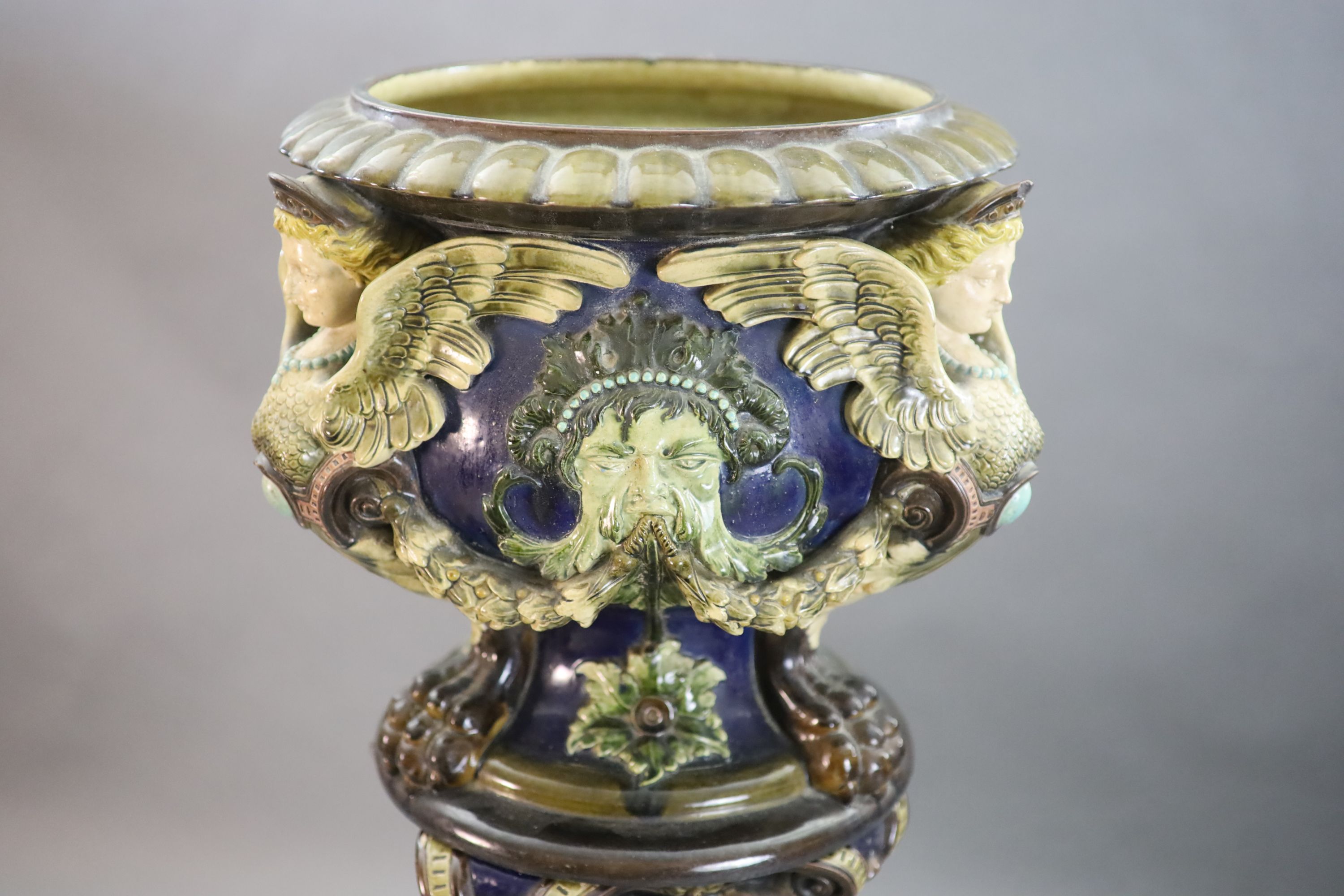 A Continental Palissy style grotesque pottery jardiniere and associated pedestal, late 19th century, total height 134cm